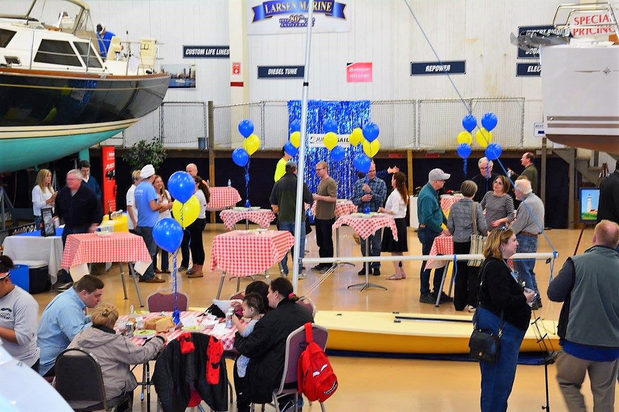 Last year's Annual WYC Junior Sail Spaghetti Dinner + Reunion also was held in the showroom of Larsen Marine Service.